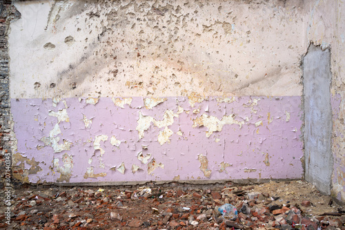 cracked and peeling paint and grunge old wall with texture photo