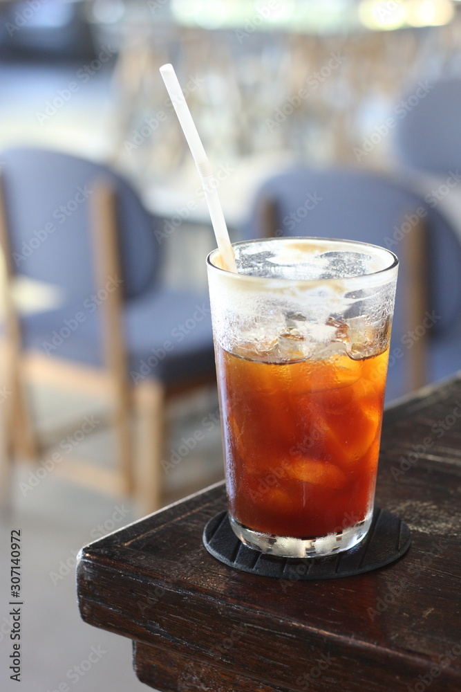 Black coffee with ice on table in cafe. Black coffee with ice on table in cafe.