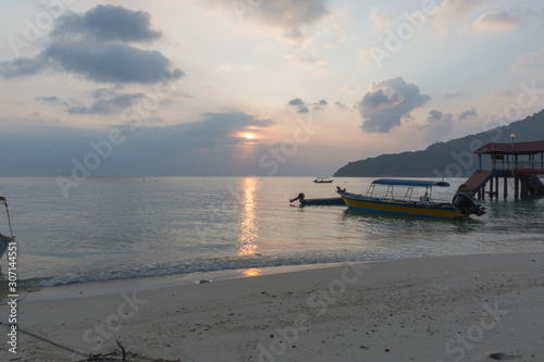 Sunset and boats at Perhentian islands in Teregganu in Malaysia photo