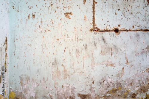 cracked and peeling paint and grunge old wall with texture