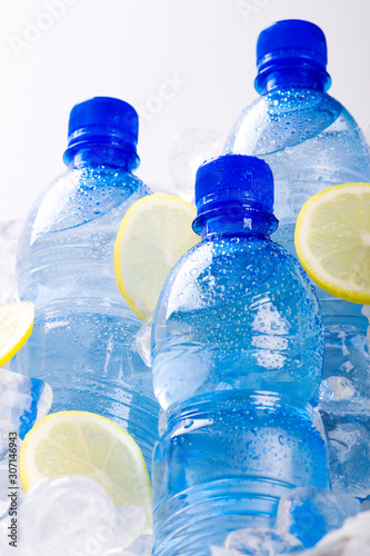 Bottles of mineral water with slices of lemon © Dorota