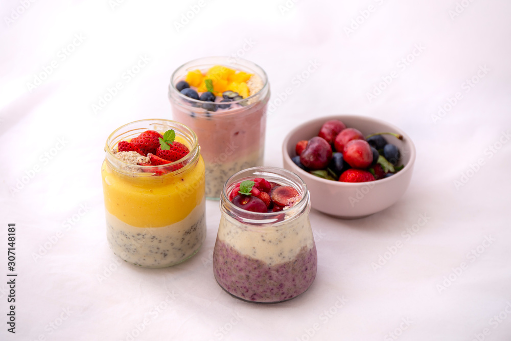 Chia pudding and fresh fruit smoothie, mango, berry, cherry Chia pudding and fresh fruit smoothie, mango, berry, cherry