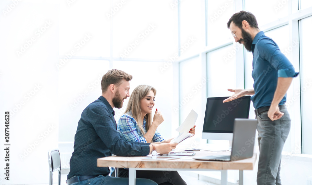 group of business people discussing something near the office Desk group of business people discussing something near the office Desk