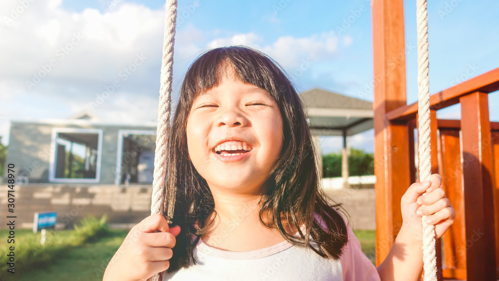 5 years old.Asian child girl playing on playground in outdoor park ...