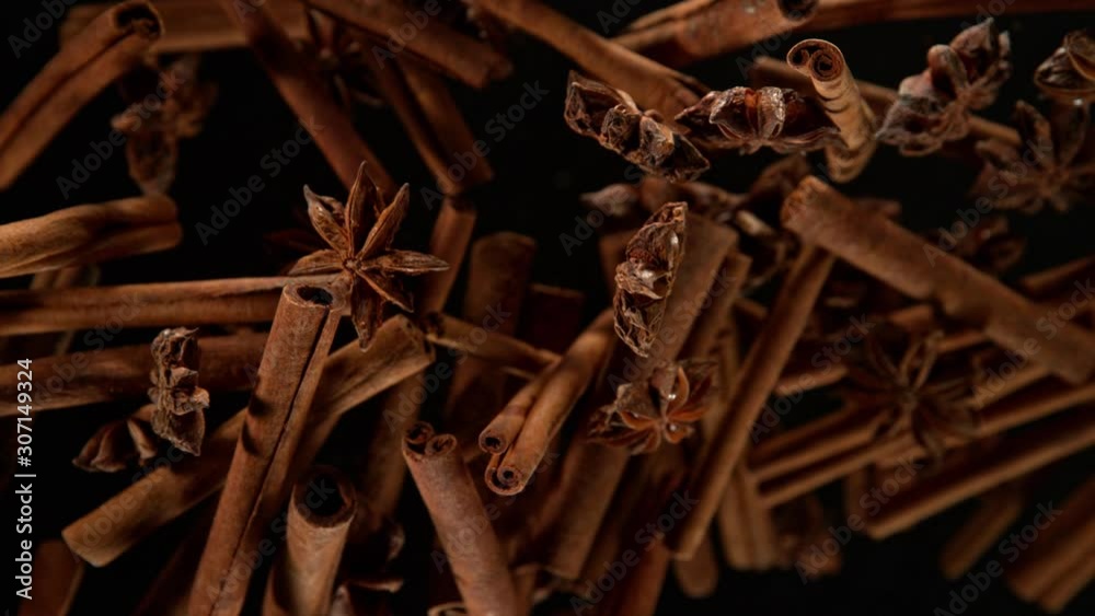Super Slow Motion Shot of Cinnamon and Star Anise Explosion on Black Background at 1000fps.