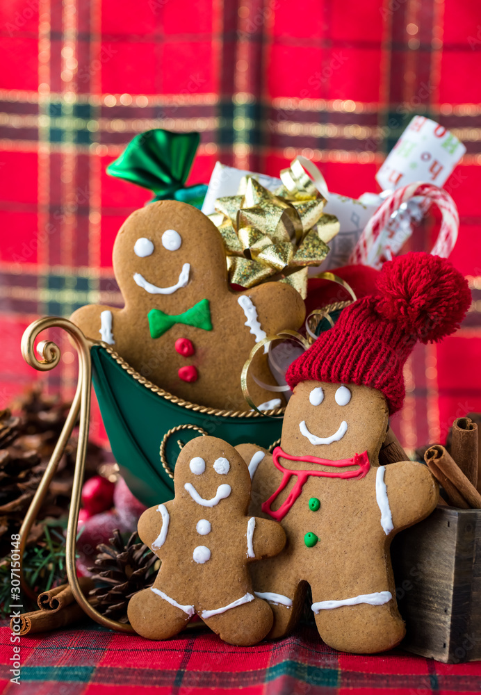 Gingerbread family with sleigh and presents.