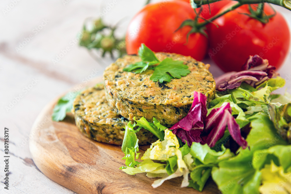 Vegetarian food Wheat Gluten Steaks with spinach Vegetarian food Wheat Gluten Steaks with spinach