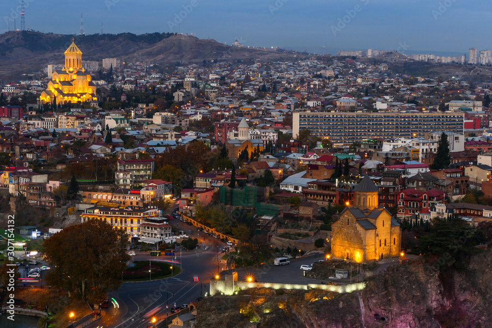 Tbilisi, Georgia The city at dusk and the Holy Trinity Cathedral of Tbilisi in the background.