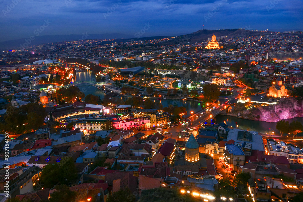 Tbilisi, Georgia The city at dusk and the Holy Trinity Cathedral of Tbilisi in the background.