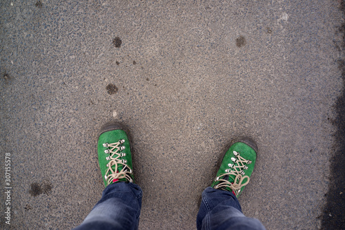 legs with green shoes