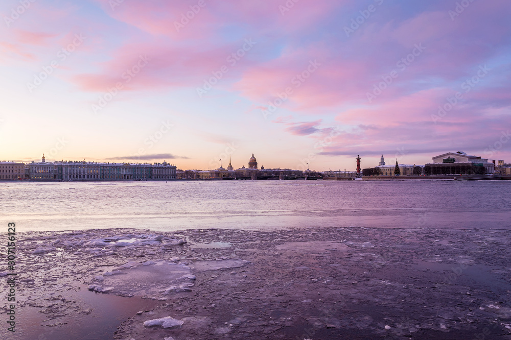 beautiful pink clouds at dawn over the waters of the Neva river