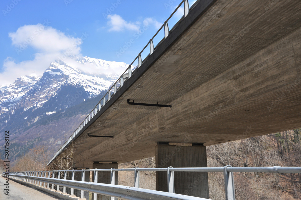 Highway Bridge and Snow-capped Mountain in Switzerland. Highway Bridge and Snow-capped Mountain in Switzerland.
