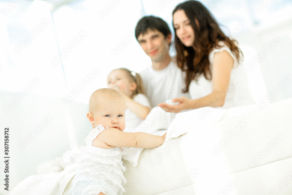 little baby on blurred background of the family.photo with copy little baby on blurred background of the family.photo with copy