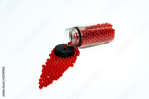 red balls for airsoft on a white background