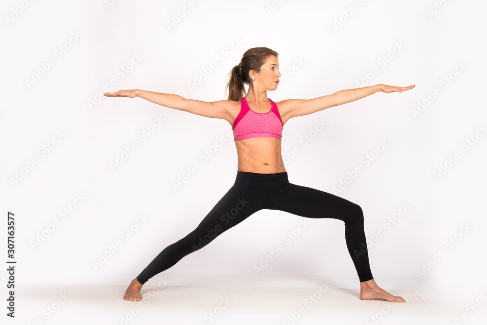 Girl practicing yoga poses, yoga female instructor. Isolated on white, indoor photo