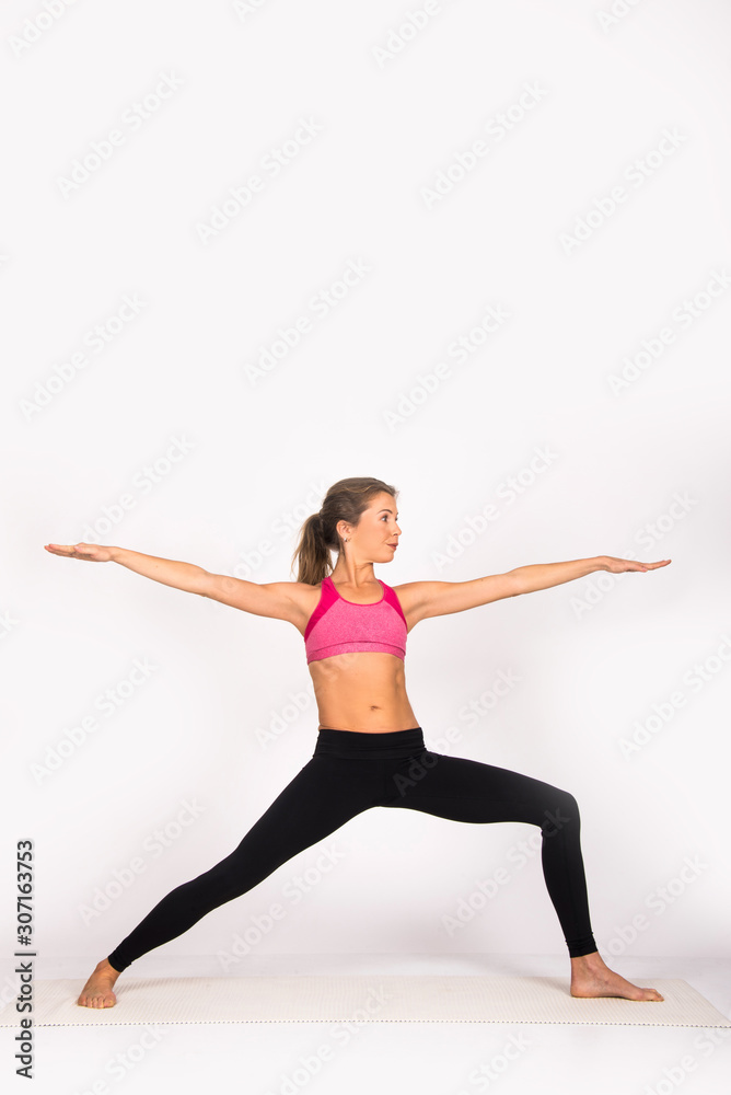 Girl practicing yoga poses, yoga female instructor. Isolated on white, indoor photo