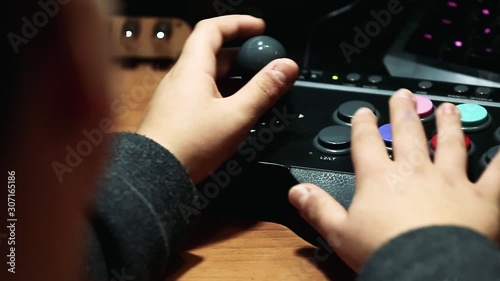 hands moving a vintage arcade pad