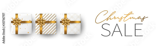 Christmas sale banner or header background. Xmas celebration white luxury design with presents. Winter holiday concept. Realistic gift boxes with gold ribbon and bow. Vector illustration.