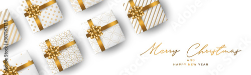 Christmas banner or header background. Xmas celebration white luxury design with presents. Winter holiday concept. Realistic gift boxes with gold ribbon and bow. Vector illustration.