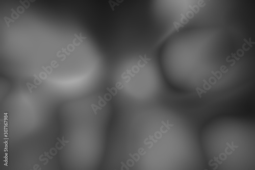 Blurred gradient dark gray background. Smooth plastic wave. Dark silk texture
