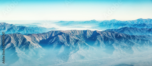 Aerial view of the Andes mountains, approaching Santiago © atosan