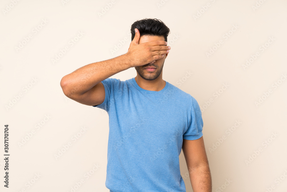 Young handsome man over isolated background covering eyes by hands. Do not want to see something Young handsome man over isolated background covering eyes by hands. Do not want to see something