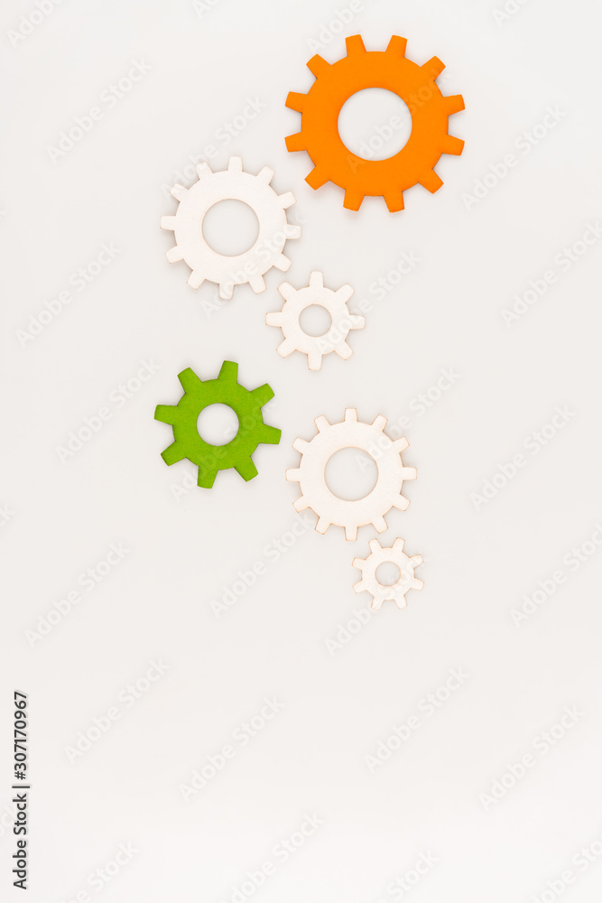 top view of colorful gears isolated on white top view of colorful gears isolated on white