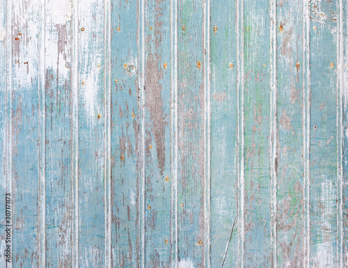 Closeup shot of an old blue wooden door texture. Wood background.