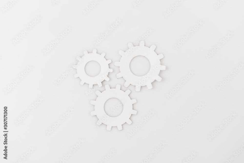 top view of round gears isolated on white top view of round gears isolated on white
