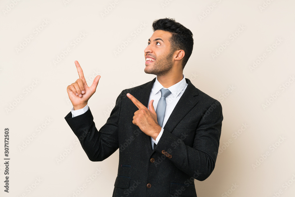 Young handsome businessman man over isolated background pointing with the index finger a great idea Young handsome businessman man over isolated background pointing with the index finger a great idea