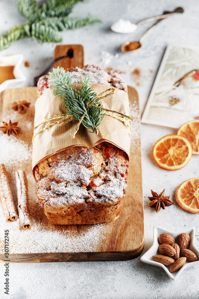 Stollen is a fruit bread of nuts, spices, and dried or candied fruit, coated with powdered sugar. It is a traditional German bread