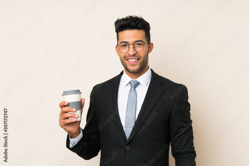 Young handsome businessman man holding coffee to take away over isolated background Young handsome businessman man holding coffee to take away over isolated background