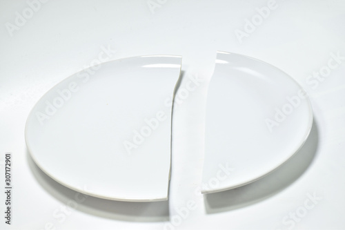 white broken plate on white background.