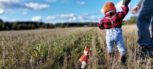 mother and son in autumn field photo