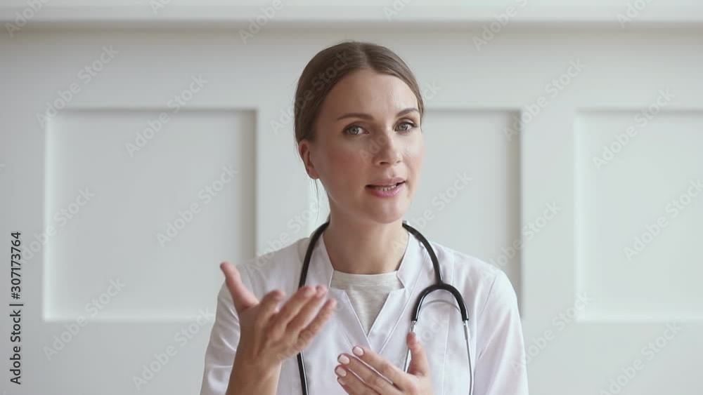 Young female general practitioner explaining diagnosis details. Young female general practitioner explaining diagnosis details.