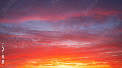 Beautiful bright sunset with multi-colored dramatic clouds