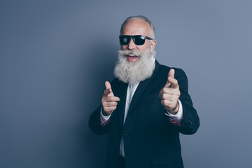 Close-up portrait of his he nice attractive trendy content cheerful cheery cool gray-haired man macho pointing two forefingers take pick you isolated over dark grey pastel color background