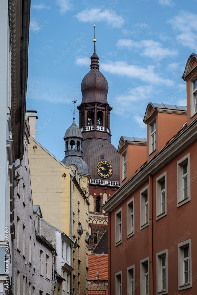 Obraz premium Cathedral in the old city. Narrow street in Riga.