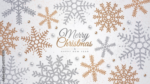 Happy New Year and Merry Christmas. Realistic background with golden and silver snowflakes. Vector holiday illustration for banner, postcard, website
