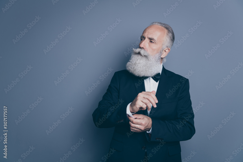 Portrait of his he nice attractive content proud arrogant rich wealthy gray-haired man ceo boss chief fixing button looking aside isolated over dark grey pastel color background Portrait of his he nice attractive content proud arrogant rich wealthy gray-haired man ceo boss chief fixing button looking aside isolated over dark grey pastel color background