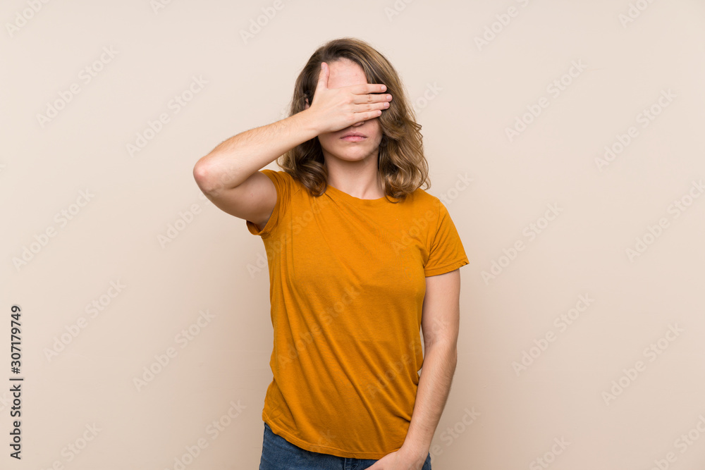 Young blonde girl over isolated background covering eyes by hands. Do not want to see something Young blonde girl over isolated background covering eyes by hands. Do not want to see something