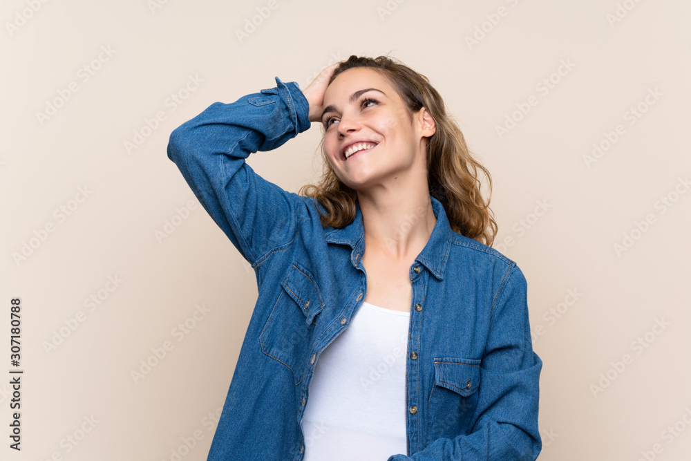 Young blonde woman over isolated background laughing Young blonde woman over isolated background laughing