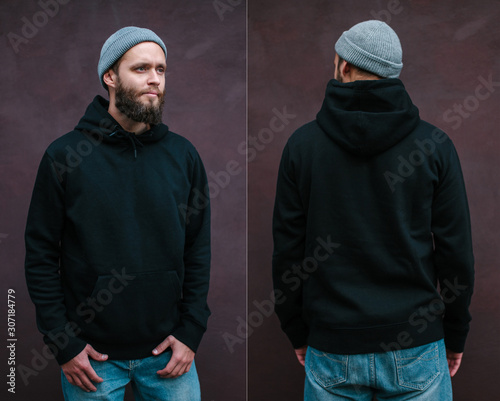 City portrait of handsome hipster man with beard wearing black blank hoodie or sweatshirt with space for your logo or design. Front and back view mockup of black hoodie photo