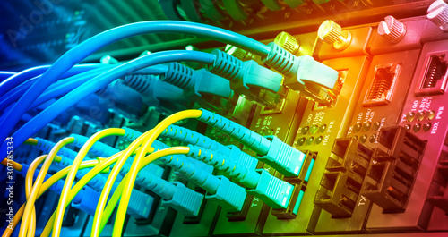 Fiber Optic cables connected to optic ports and UTP, Network cables connected to ethernet ports.