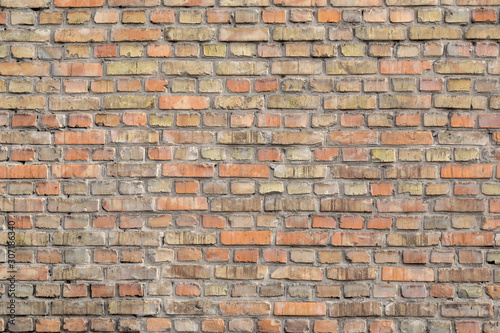 Brick wall with old vintage bricks background or texture.