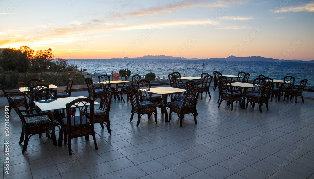 evening sunset on terrace bar of the resort, the beautiful sky and sea , Europe, Greece