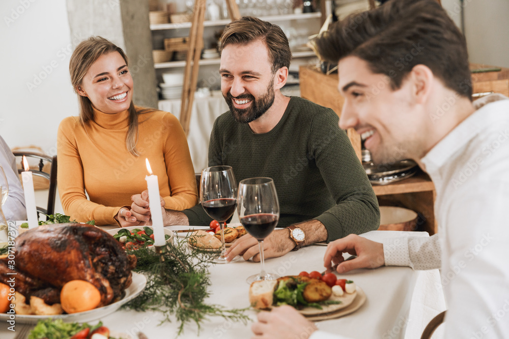 Happy big family celebrating Christmas together at home Happy big family celebrating Christmas together at home