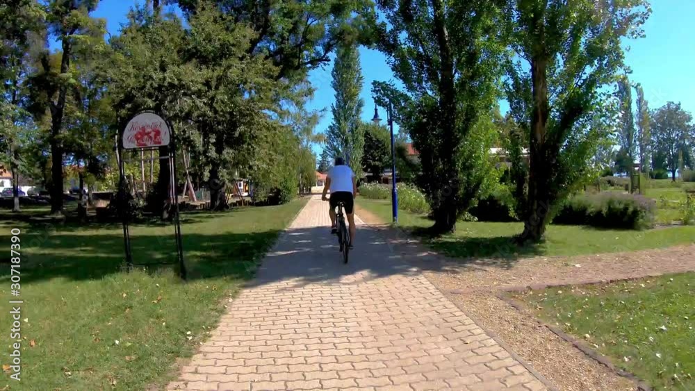 Young sporty man cicling near the lake Balaton of Hungary Young sporty man cicling near the lake Balaton of Hungary