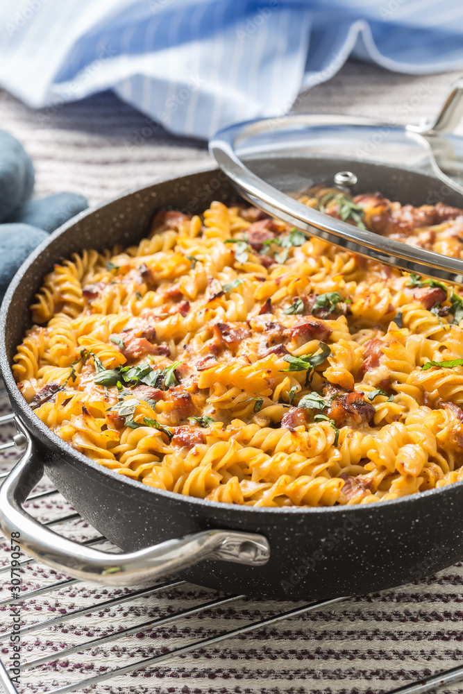 Baked pasta fusilli with smoked pork neck mozzarela cheese and othe ingredients Baked pasta fusilli with smoked pork neck mozzarela cheese and othe ingredients