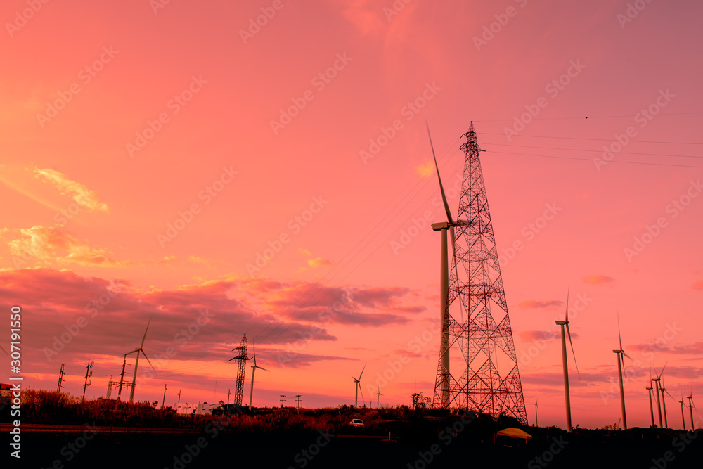 Wind turbines are generating electricity with sunset.